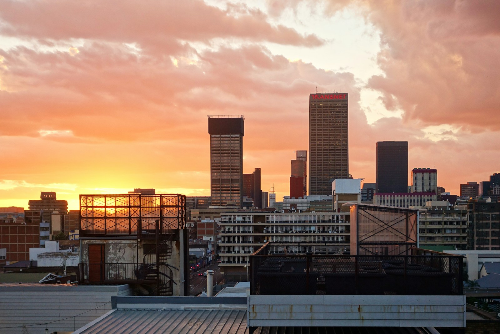 Johannesburg city skyline with high-rise buildings and vibrant city life. Johannesburg is South Africa’s bustling heartbeat—full of history, art, and energy. Crab a Ride connects you to it all at an affordable price.
